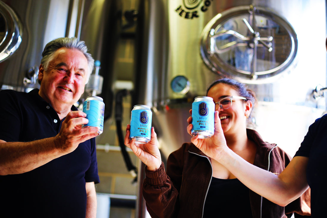 How is Alcoho Free Beer Made? blog image featuring the Nirvana Brewery Team holding up the Nirvana Pilsner at the Brewery